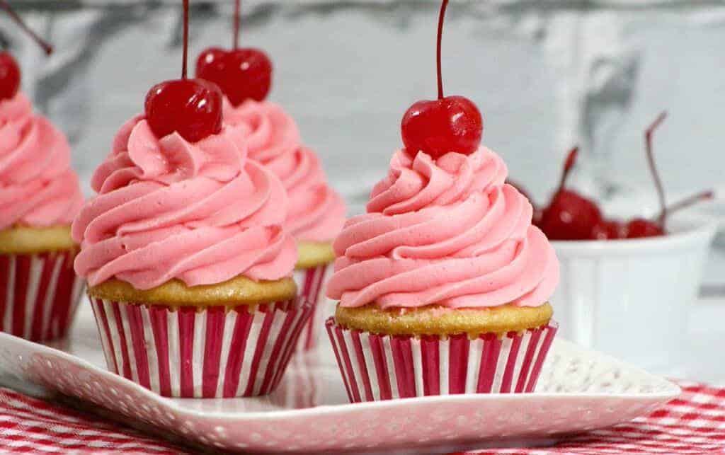 Looking for the perfect Canada Day recipe for your dessert table? These cherry vanilla cupcakes aren't just delicious, they look festive & fun too!