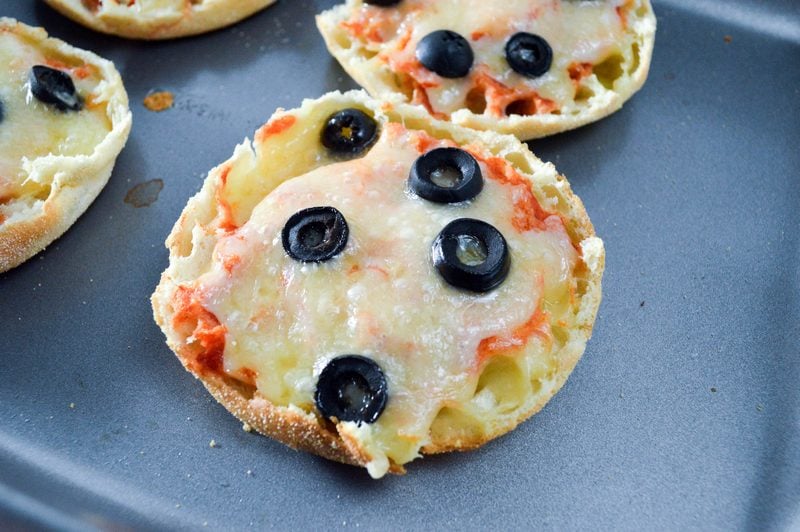 Need a quick and easy after school snack? How about English muffin mini pizzas? They're fast, fun and easy to customize to everyone's tastes. 