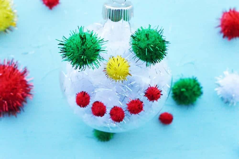 Get a head start on your homemade tree decorations with an easy Christmas craft that's perfect for kids and adults alike with our DIY pom-pom ornaments!