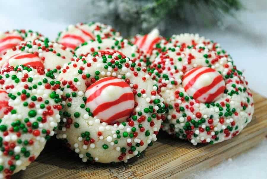 Ready for a really fun and tasty Christmas recipe for kids? These Candy Cane Peppermint Kisses cookies are so much fun to make together!